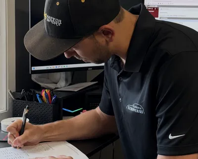 Noble Metal Ball Pen - Filling out repair orders with my custom logo pen and shirt