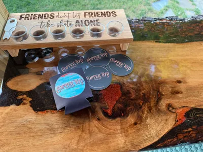 Full Color Collapsible - Koozies and bar drink coasters on the copper bar at the Copper Top Retreat